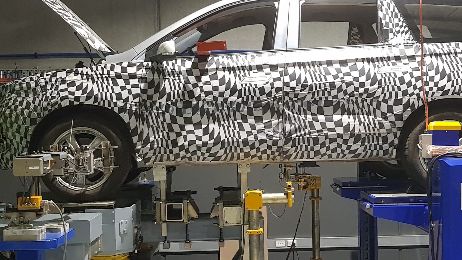 Kinematics and Compliance (K&C) rig